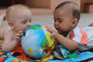 two babies playing